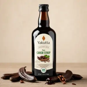 carob syrup bottle with carobs