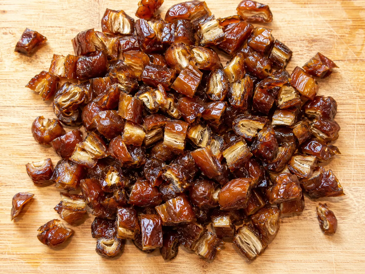 Chopped Dates on Wooden Board